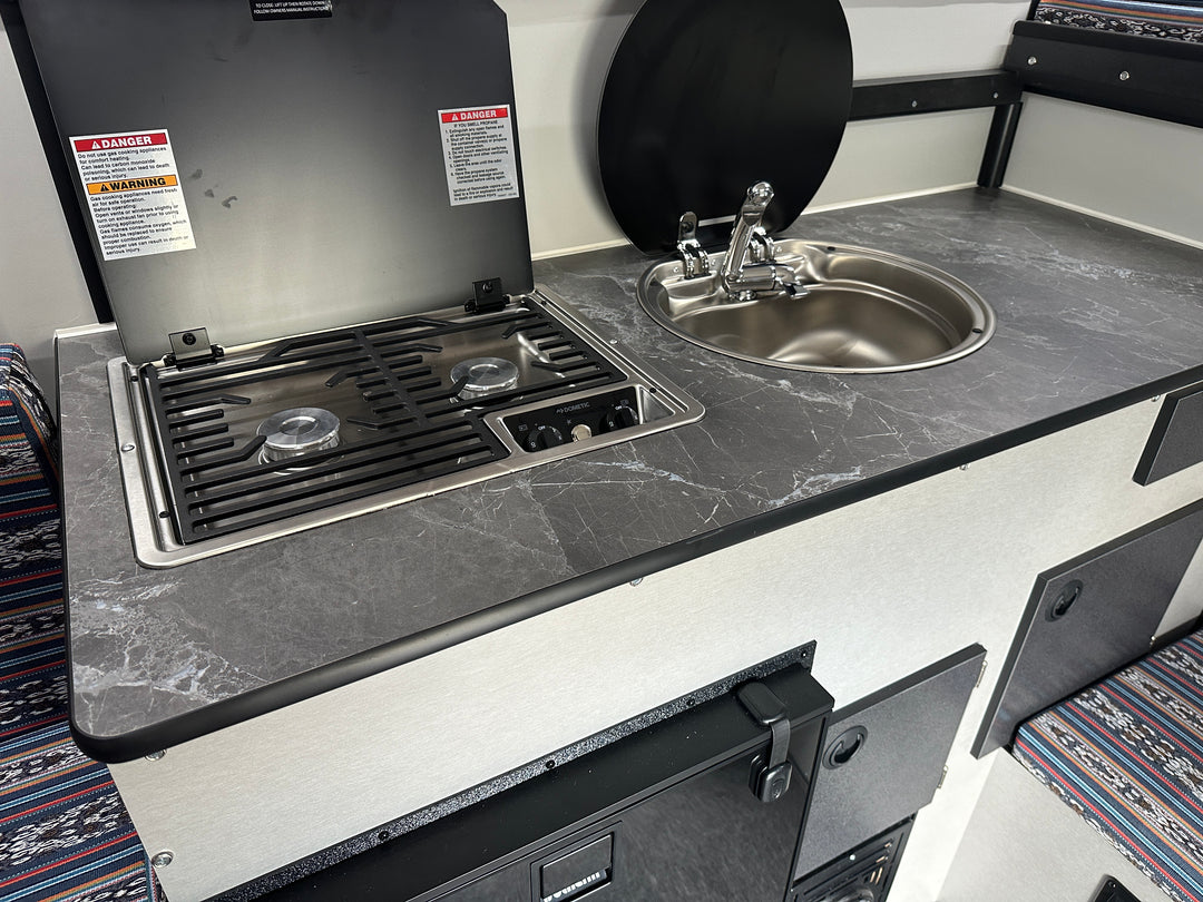 Pre-Owned Four Wheel Campers Grandby Flatbed Camper