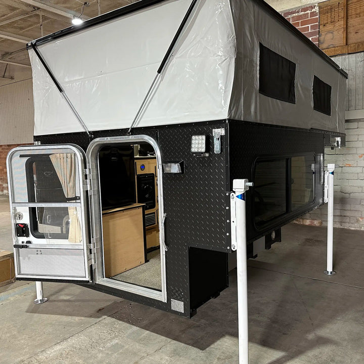 Pre-Owned Four Wheel Campers Fleet Side Dinette Camper