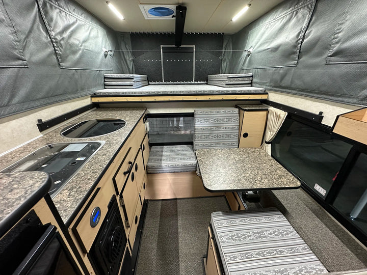Pre-Owned Four Wheel Campers Fleet Side Dinette Camper